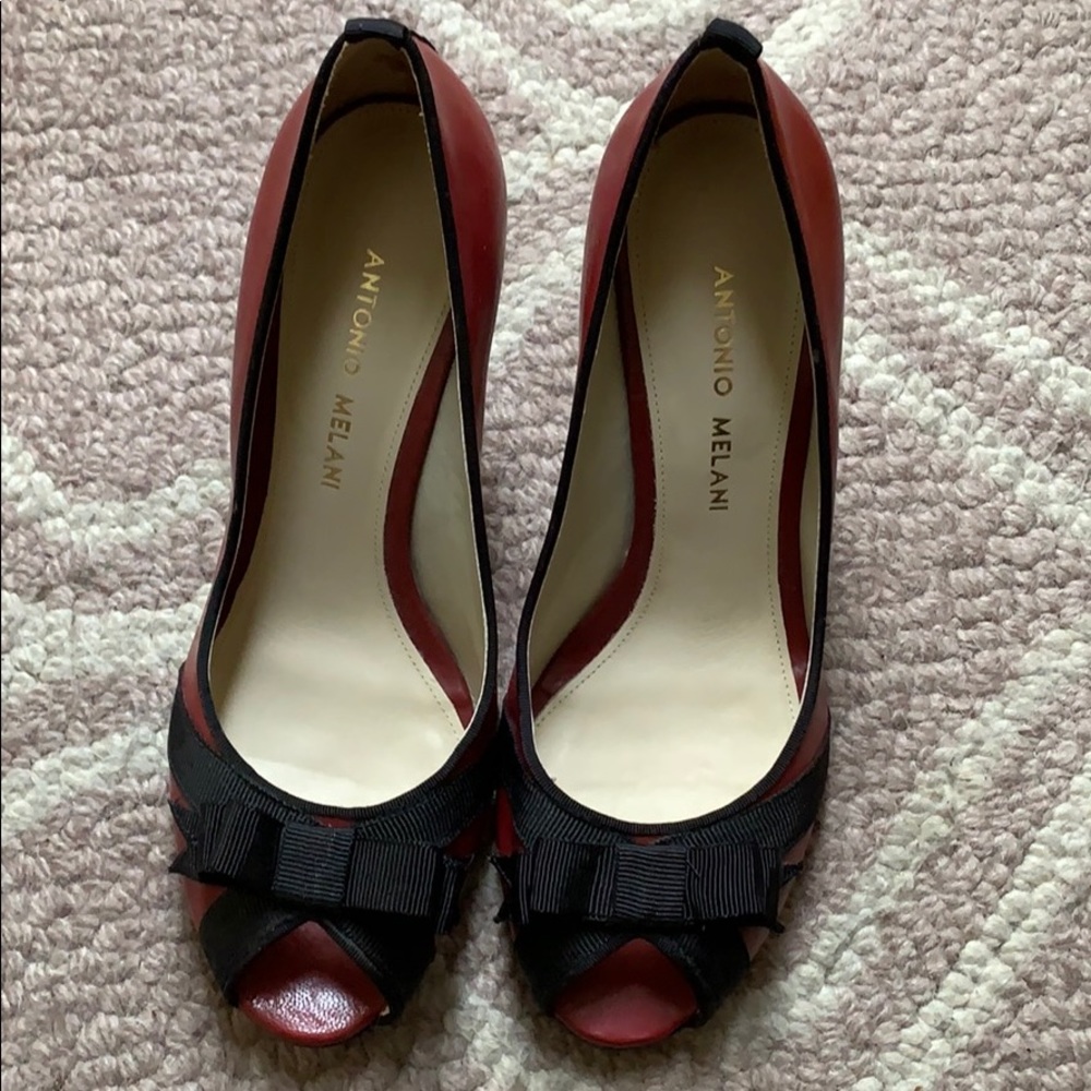 Antonio Melani red with black bow pumps.